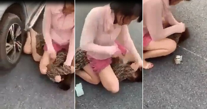 Clip: Vợ đè bồ nhí xuống đường, cầm giày cao gót phang tới tấp vào đầu dù bị can ngăn Ảnh 1