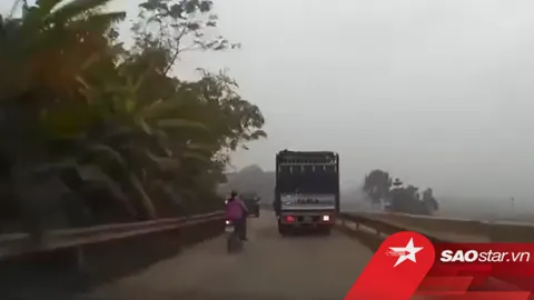 Người phụ nữ liều lĩnh lách giữa 2 xe tải để vượt lên trước, cảnh tượng sau đó khiến tất cả 'đứng tim'