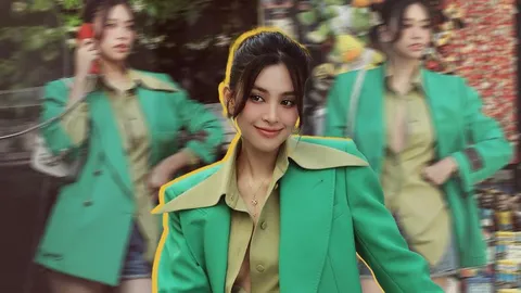 Hậu ồn ào diện đồ táo bạo, Hoa hậu Tiểu Vy tiếp tục khoe 'cặp tuyết lê' với sơ mi bung cúc tại trời Âu