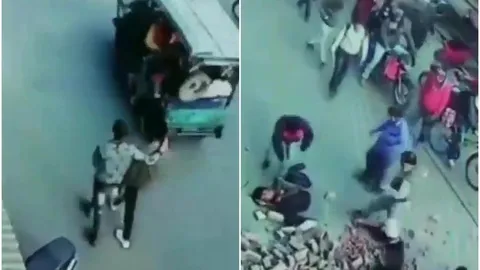 Khoảnh khắc kinh hoàng: Cả đống gạch rơi vào hai người đàn ông đang đi đường