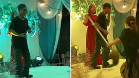 Clip: Đang nhảy nhót trên sân khấu đám cưới, người đàn ông bị vợ cầm chổi đánh khiến hội hôn ngỡ ngàng