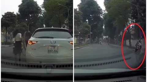 CLIP: Nữ tài xế ra hiệu dừng xe giữa ngã tư, hành động sau đó của chị khiến mạng xã hội Việt rần rần khen ngợi