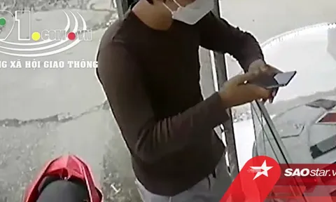 Clip: Nam thanh niên vờ hỏi mua điện thoại rồi cầm chạy mất, chủ cửa hàng 'phi' qua tủ kính đuổi theo