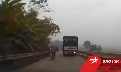 Người phụ nữ liều lĩnh lách giữa 2 xe tải để vượt lên trước, cảnh tượng sau đó khiến tất cả 'đứng tim'