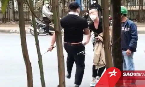 Clip: Đánh vợ ngay giữa đường, gã chồng bị nam bảo vệ đấm túi bụi phải rối rít xin tha