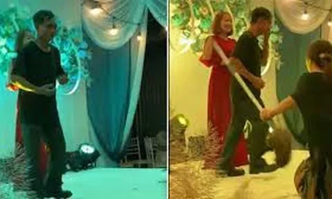 Clip: Đang nhảy nhót trên sân khấu đám cưới, người đàn ông bị vợ cầm chổi đánh khiến hội hôn ngỡ ngàng