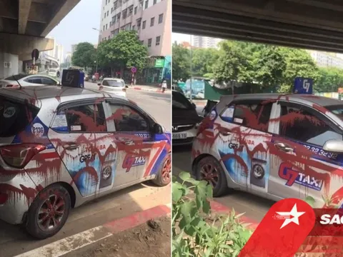 Đỗ xe dưới gầm cầu qua đêm, tài xế taxi 'phát sốt' khi thấy chiếc xe bị xịt sơn đỏ kín các góc