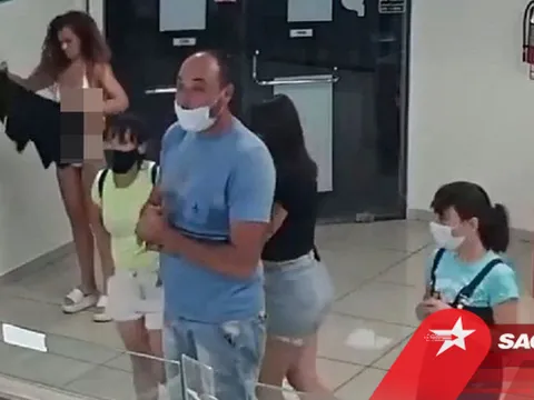 Thản nhiên cởi đồ khi bị yêu cầu đeo khẩu trang tại quán kem, người phụ nữ khiến nhiều người ái ngại