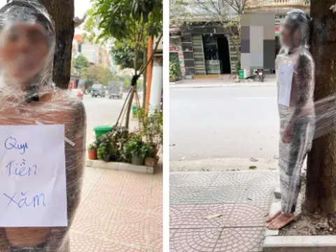 Dân mạng 'rét run cầm cập' khi trông thấy nam thanh niên bị lột áo, quấn băng trói vào gốc cây giữa trời lạnh giá vì nợ tiền xăm hình