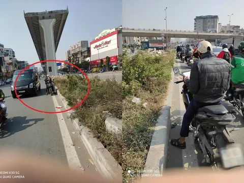 Dừng xe chờ đèn đỏ, nam sinh lấy sách vở ra ôn bài khiến nhiều người chú ý