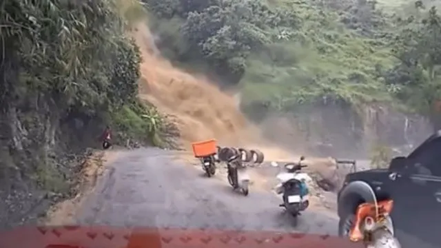 Clip: Rùng mình tài xế lái xe qua đường đèo nước lũ chảy cuồn cuộn